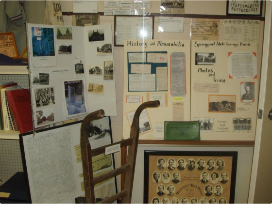 Several posterboards displaying historical photographs and memorabilia.